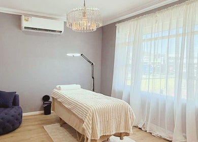 Spacious treatment room with massage bed at Maison Formé, Morley, Western Australia, AU.