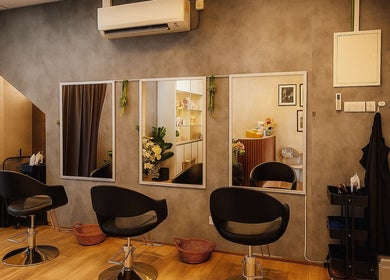 Modern salon interior at Insaniah Spa & Saloon, Kepala Batas, Pulau Pinang, MY with sleek chairs and mirrors.