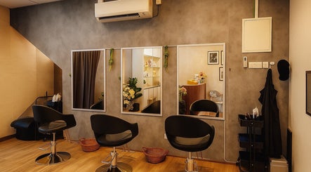 Modern salon interior at Insaniah Spa & Saloon, Kepala Batas, Pulau Pinang, MY with sleek chairs and mirrors.