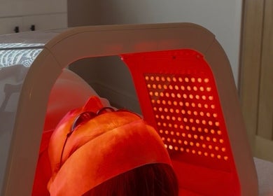 Client receiving LED light therapy at Positive Skincare, Monton, England, GB for rejuvenated skin.
