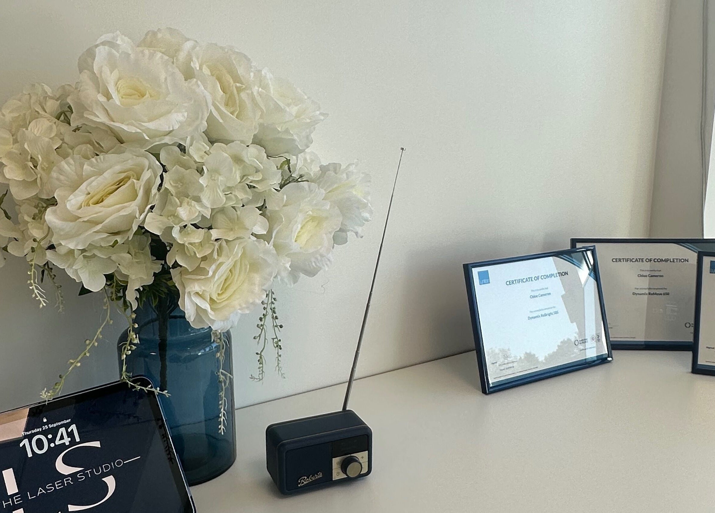 Floral arrangement and certificates at The Laser Studio EK, East Kilbride, College Milton South, Scotland, GB.