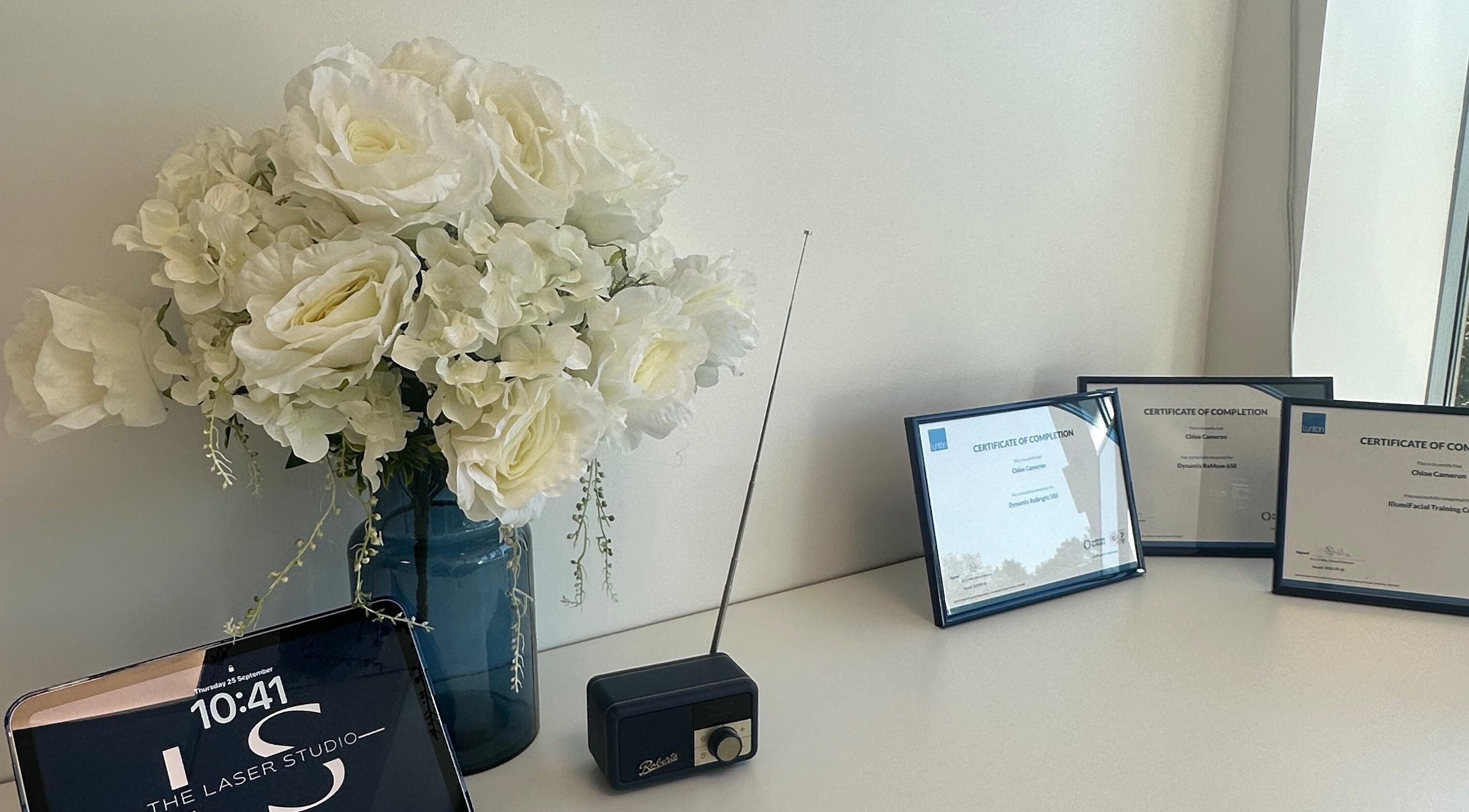 Floral arrangement and certificates at The Laser Studio EK, East Kilbride, College Milton South, Scotland, GB.