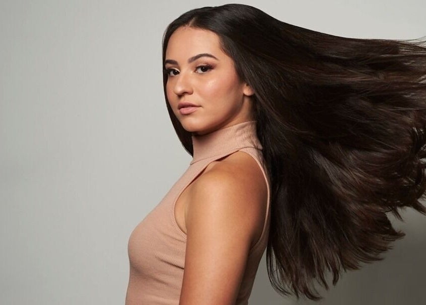 Hair flowing gracefully at Blond Plus Felix, Hong Kong Island, HK.