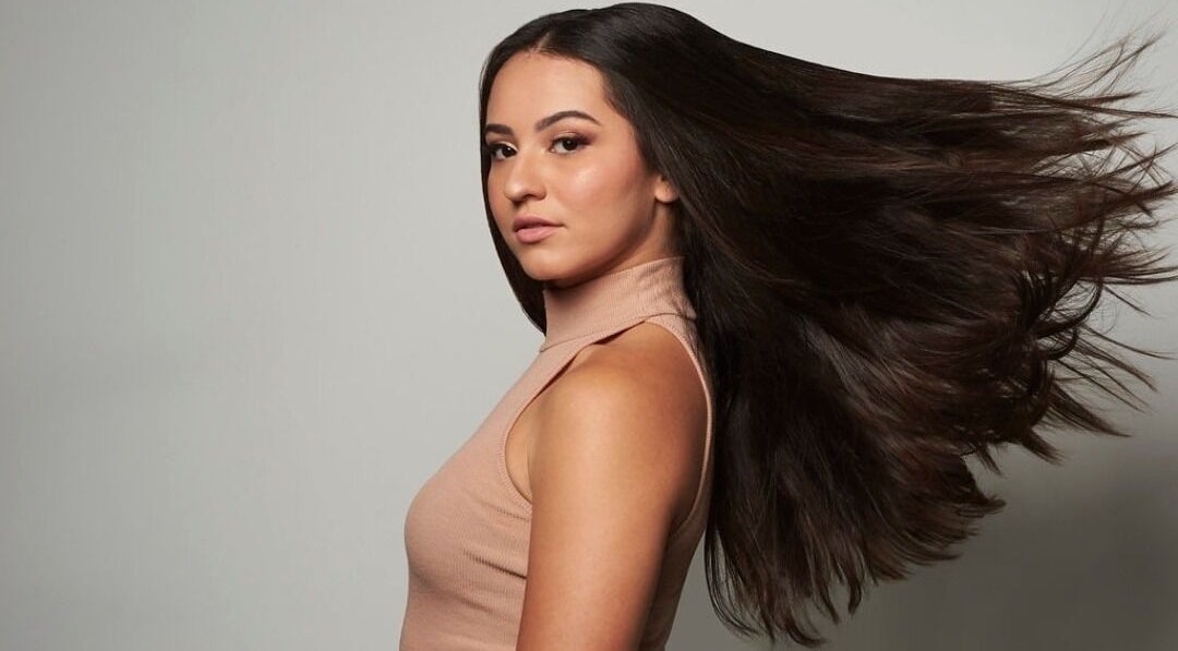 Hair flowing gracefully at Blond Plus Felix, Hong Kong Island, HK.