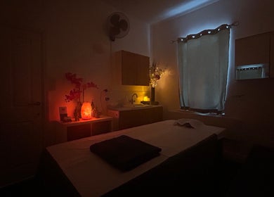 Cozy massage room at The Lux Thai Massage, Norwich, England, GB, with dim lighting and calming decor.