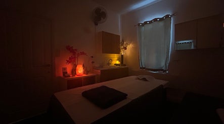 Cozy massage room at The Lux Thai Massage, Norwich, England, GB, with dim lighting and calming decor.