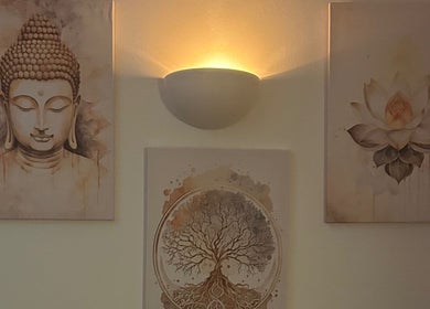 Serene wall art featuring Buddha and lotus flower at The Lux Thai Massage, Norwich, England, GB.