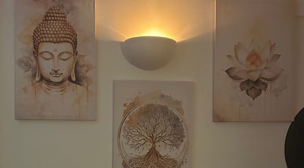 Serene wall art featuring Buddha and lotus flower at The Lux Thai Massage, Norwich, England, GB.