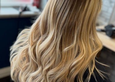 Blonde wavy hair styling at Leanne at Cabello, Eastrington, England, GB.