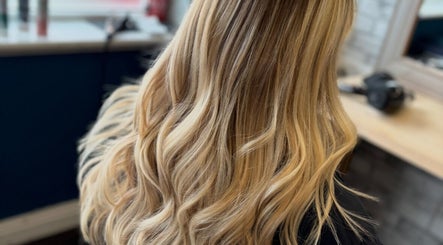 Blonde wavy hair styling at Leanne at Cabello, Eastrington, England, GB.