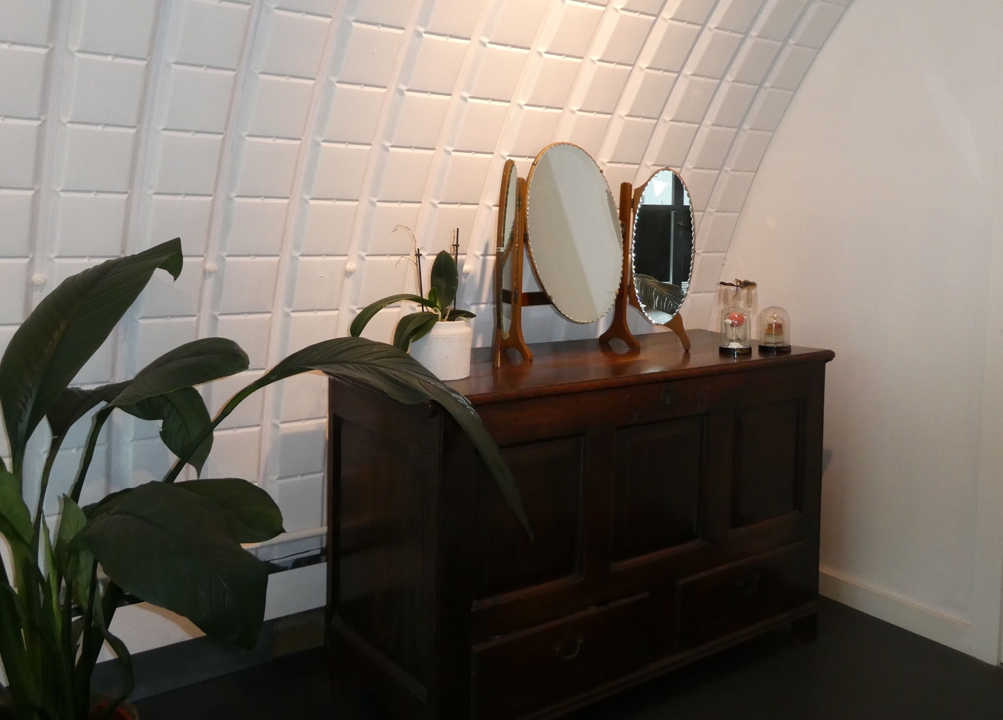 Elegant vintage mirror on wooden dresser at Artworks96s | At Quark Hair Studio, London, England, GB.