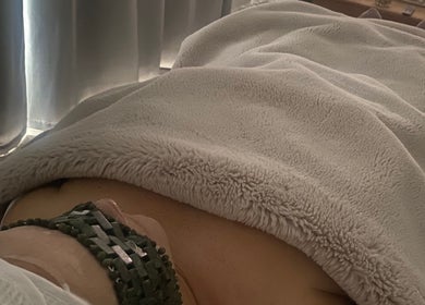 Cozy massage setting at Body & Face in Ashford, England, GB with a soft, plush blanket.