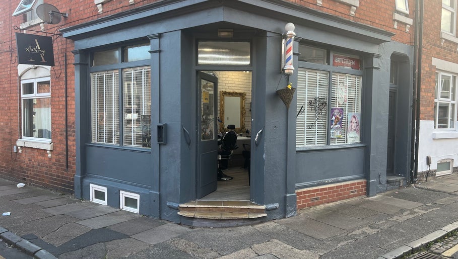Entrance of ANTHONY BARBER & BEAUTY SALOON in Northampton, England, GB, featuring a stylish exterior and cozy interior.