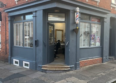 Entrance of ANTHONY BARBER & BEAUTY SALOON in Northampton, England, GB, featuring a stylish exterior and cozy interior.
