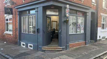 Entrance of ANTHONY BARBER & BEAUTY SALOON in Northampton, England, GB, featuring a stylish exterior and cozy interior.