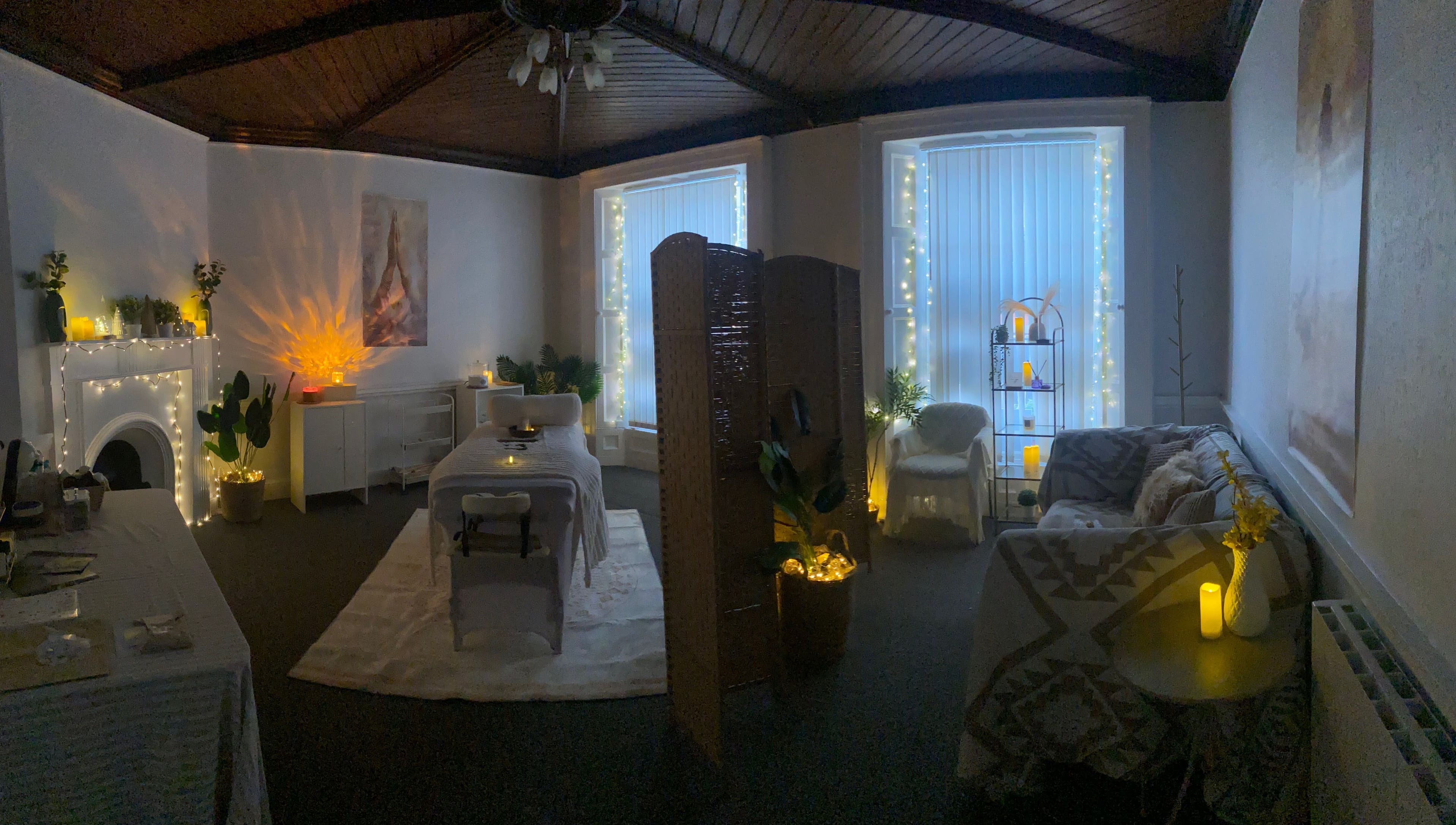 Relaxing therapy room at Alexandra in Drogheda, County Louth, IE, decorated with fairy lights and cozy seating.