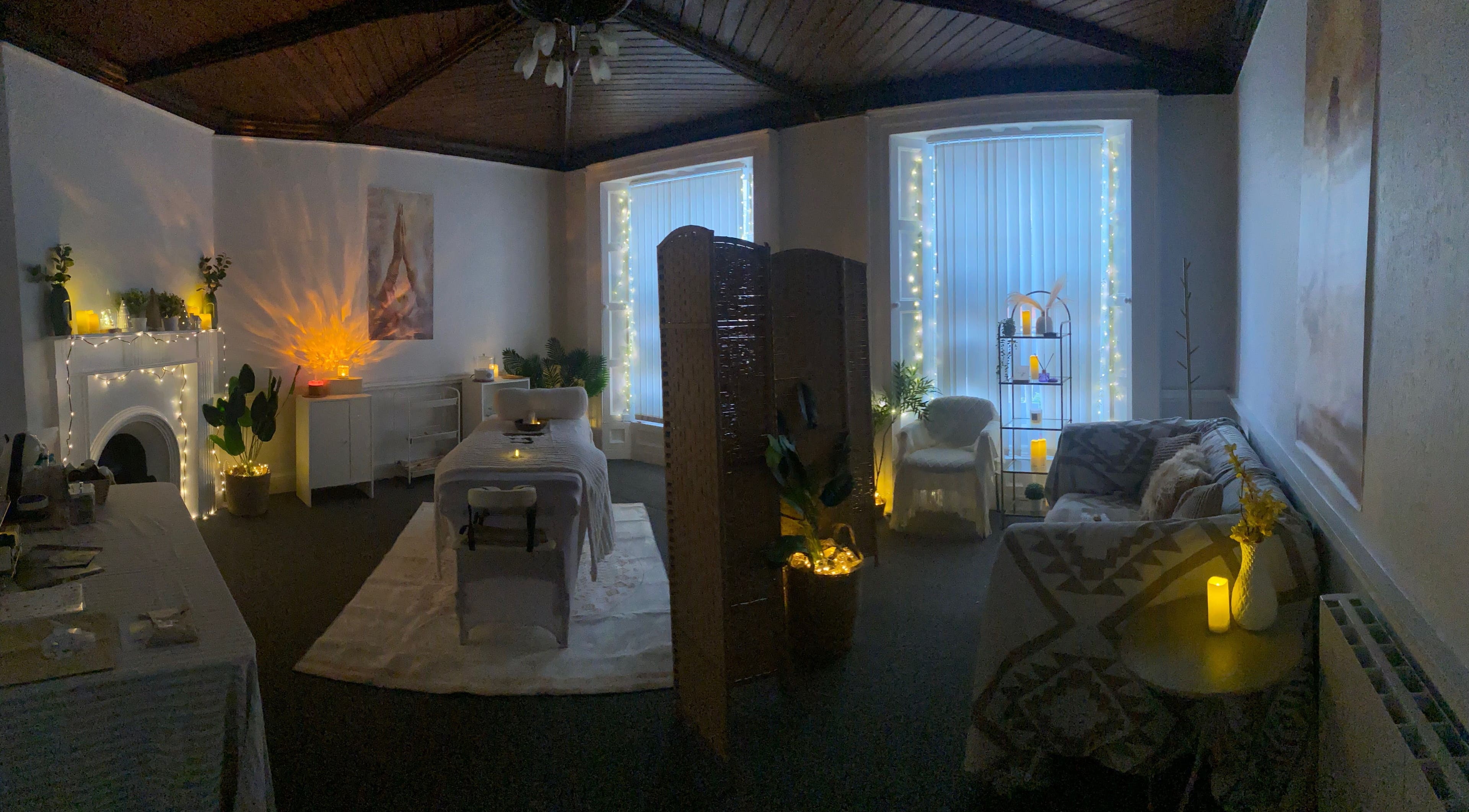 Relaxing therapy room at Alexandra in Drogheda, County Louth, IE, decorated with fairy lights and cozy seating.