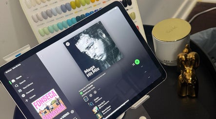 Tablet streaming music in a cozy beauty setup at Gals Perth, Langford, Western Australia, AU.