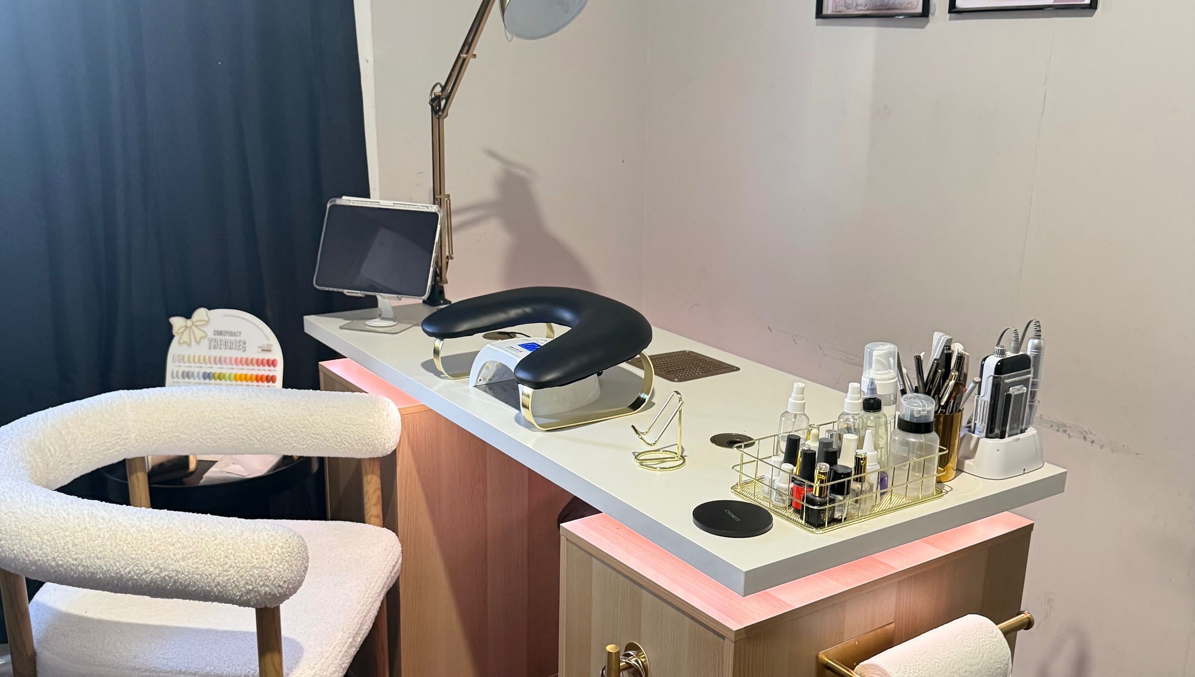 Nail care station at Gals Perth, Langford, Western Australia, AU, featuring a modern setup with tools and creams.
