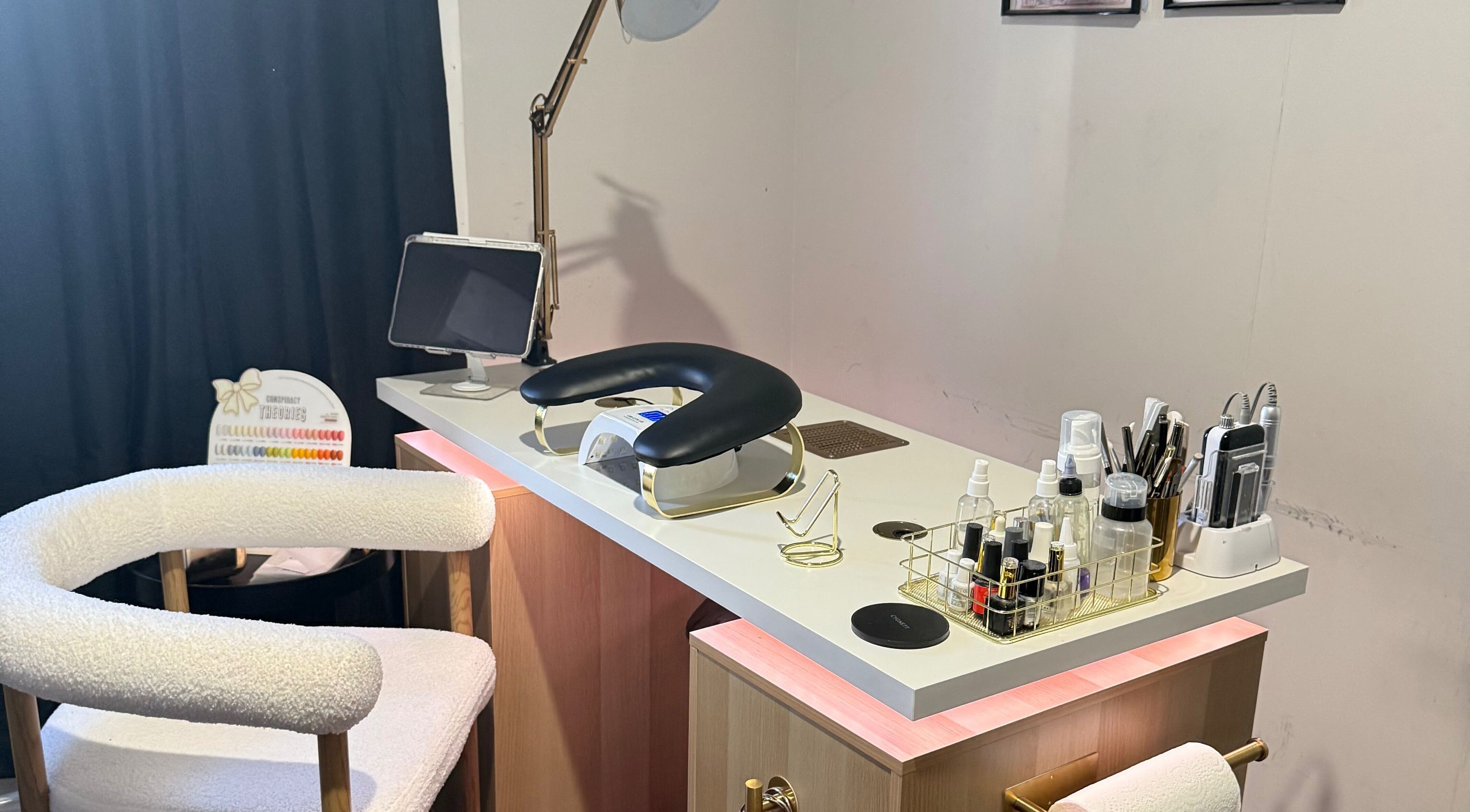 Nail care station at Gals Perth, Langford, Western Australia, AU, featuring a modern setup with tools and creams.