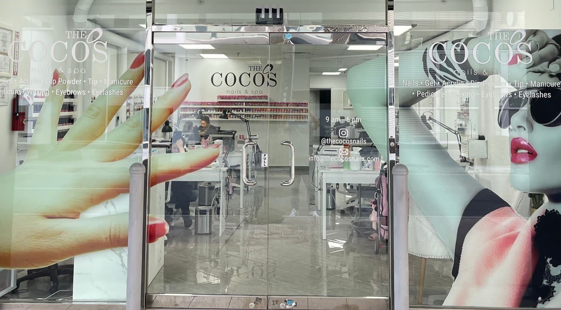 Entrance of The Coco's Nail & Spa in Miami, Florida, US with vivid nail art decor on the glass door.
