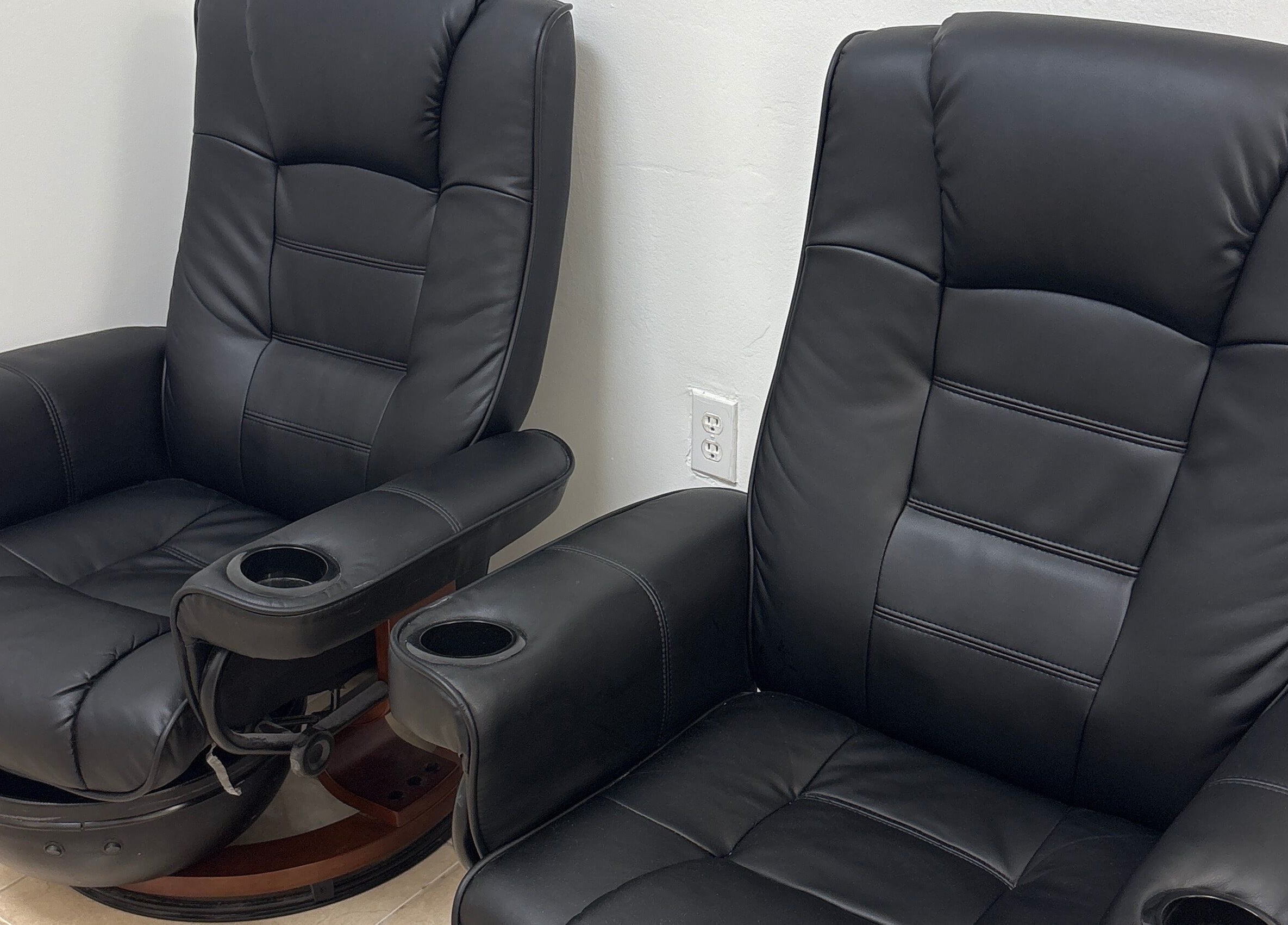 Luxurious black leather spa chairs at The Coco's Nail & Spa, Miami, Florida, US.