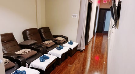 Luxurious massage chairs at Midland Health Center, Toronto, Ontario, CA, providing a premium wellness experience.