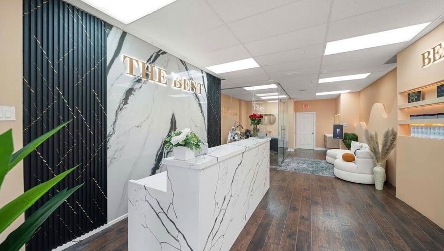 Elegant interior of Lullea Nails Shop, Toronto, Ontario, CA with marble accents and cozy seating.