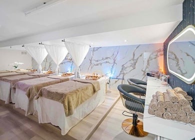 Luxurious spa room at Lullea Nails Shop in Toronto, Ontario, CA with cozy massage tables and elegant decor.