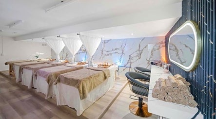 Luxurious spa room at Lullea Nails Shop in Toronto, Ontario, CA with cozy massage tables and elegant decor.