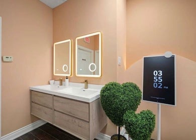 Elegant vanity area at Lullea Nails Shop, Toronto, Ontario, CA, with modern lighting and decor.
