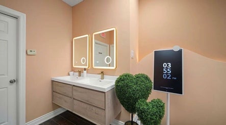 Elegant vanity area at Lullea Nails Shop, Toronto, Ontario, CA, with modern lighting and decor.