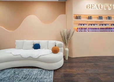 Sleek interior of Lullea Nails Shop in Toronto, Ontario, CA with plush seating and modern decor.