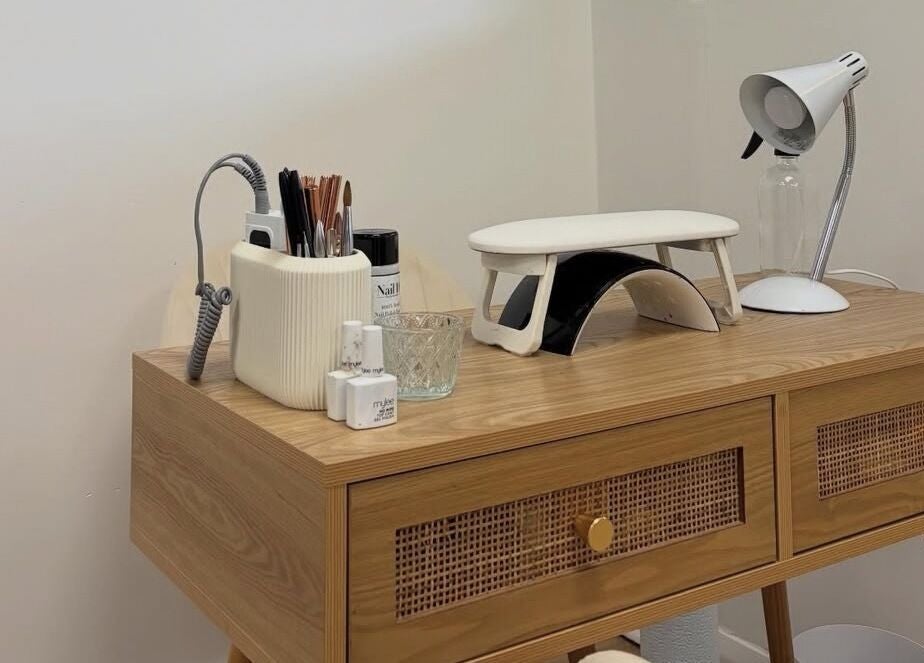 Nail care desk with tools at Tnt Nails, Worcester, England, GB, showcasing neat organization.