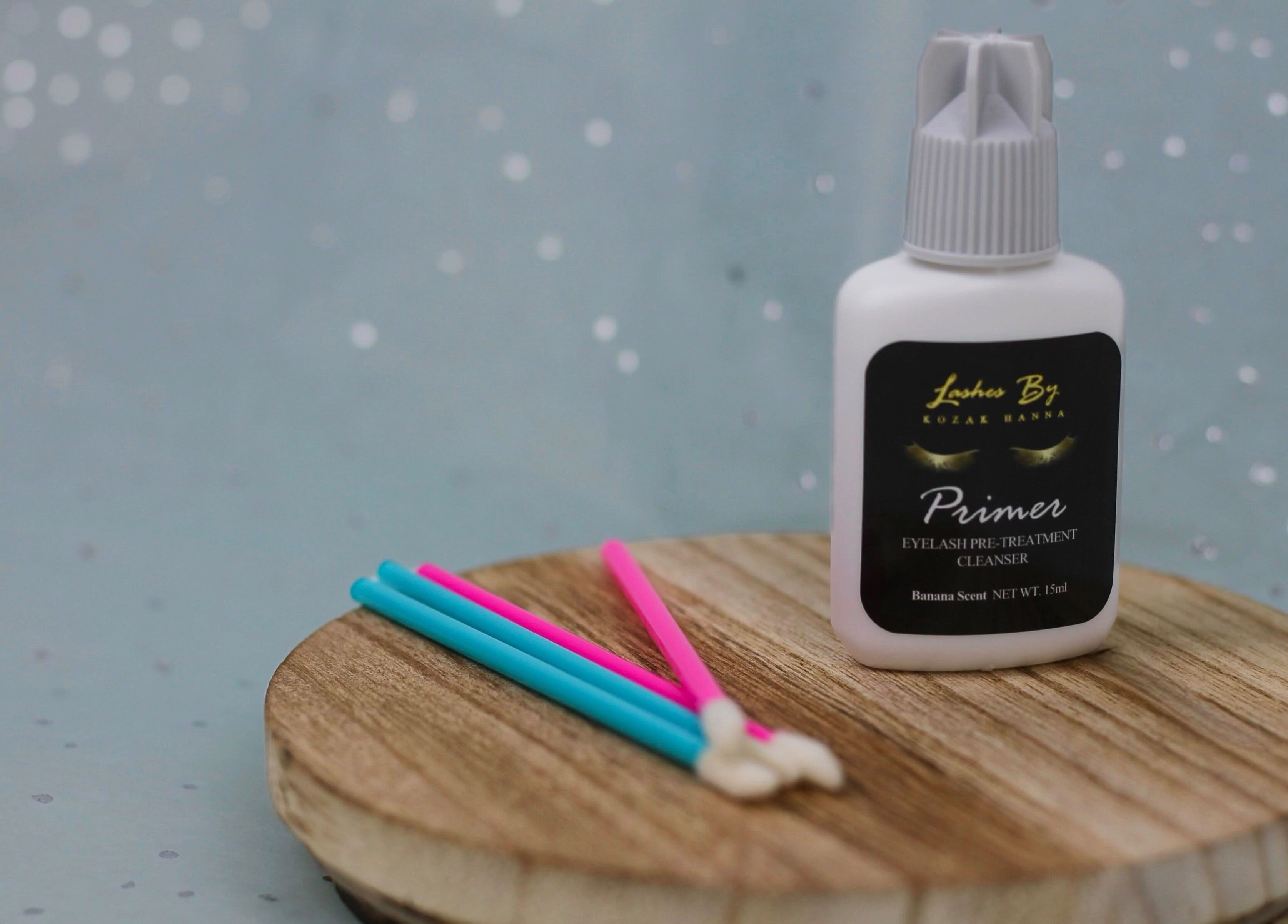 UNOVA lashes by HK in Hallandale Beach, Florida showcases eyelash primer and tools on wooden display.