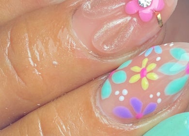 Colorful floral nail art by Carmen Sanchez Nail Art, Atlixco, Puebla, MX. Features intricate flower patterns.