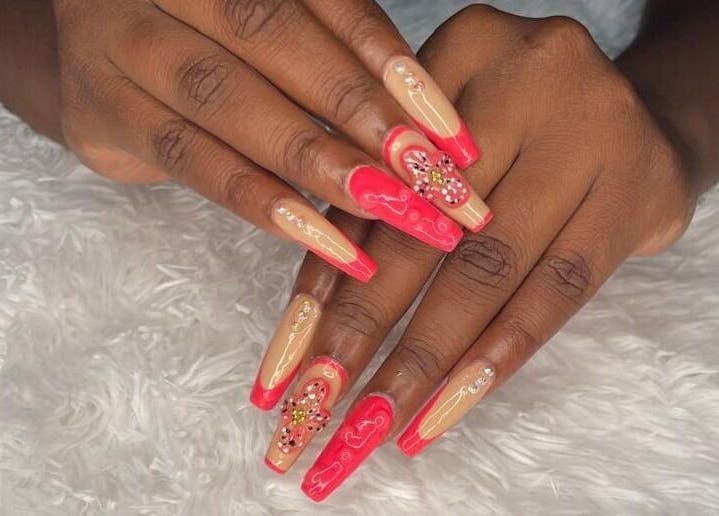 Elegant manicured nails at Tisean's Signature Nails, Kingston 6, St. Andrew Parish, JM with red and nude design.