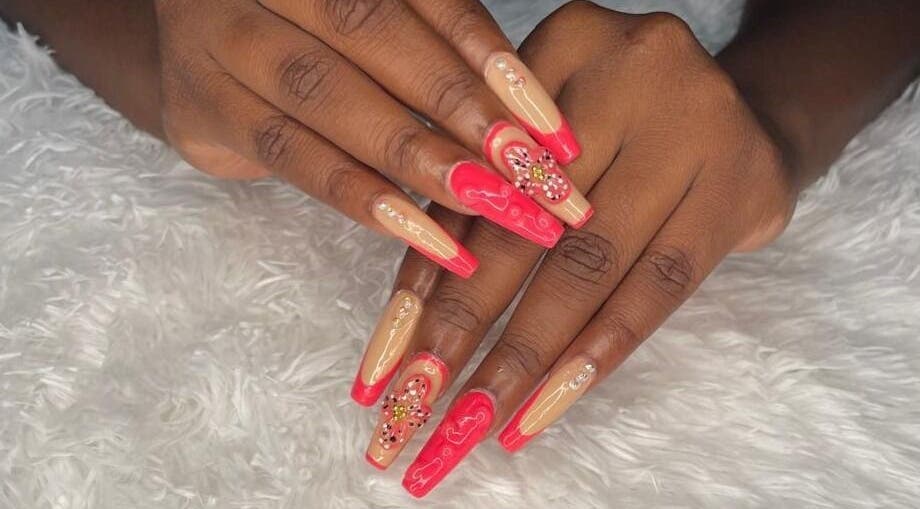 Elegant manicured nails at Tisean's Signature Nails, Kingston 6, St. Andrew Parish, JM with red and nude design.