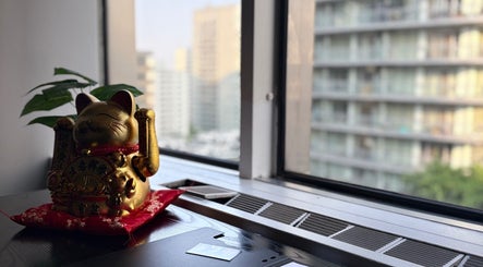 Golden cat figurine by window at Beca’s Beauty Spectrum, Toronto, Ontario, CA.