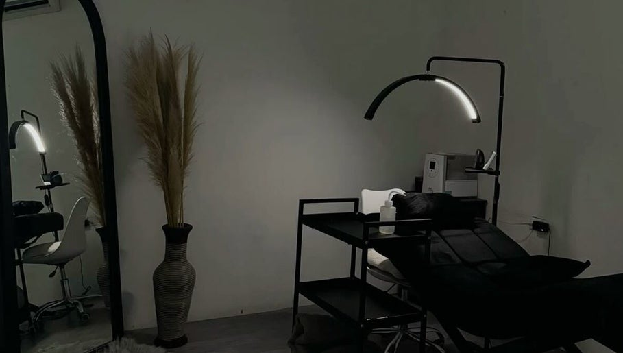 Elegant beauty treatment room at Lashology.anna in Melbourne, Victoria, AU with bed and minimalist decor.