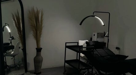 Elegant beauty treatment room at Lashology.anna in Melbourne, Victoria, AU with bed and minimalist decor.