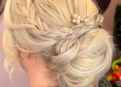 Elegant braided hairstyle with pearl pins at Poppy’s Make Up & Beauty Bar, Redditch, England, GB.