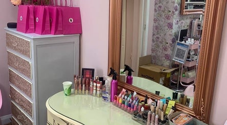 Chic makeup vanity at Poppy’s Make Up & Beauty Bar in Redditch, England, GB, featuring elegant decor and cosmetics.