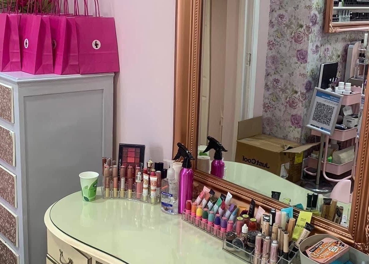Elegant makeup station at Poppy’s Make Up & Beauty Bar in Redditch, England, GB with cosmetics neatly arranged.