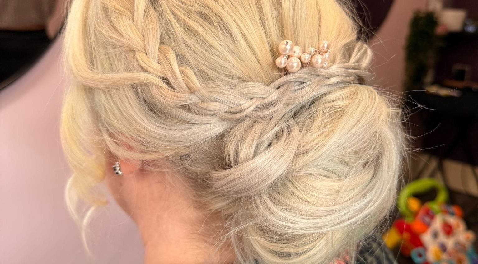 Stylish braided updo with pearls at Poppy’s Make Up & Beauty Bar, Redditch, England, GB.