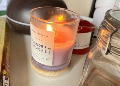 Lavender candle lit at 20Thirteen Beauty Spa, Pretoria, Gauteng, ZA, offering a calming ambiance.