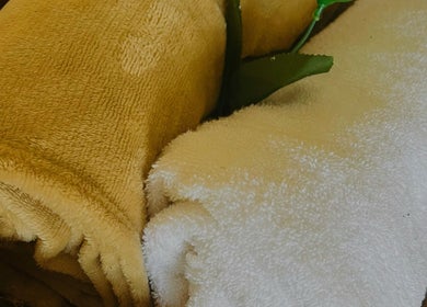 Rolled towels at 20Thirteen Beauty Spa, Pretoria, Gauteng, ZA, offering relaxation and comfort.
