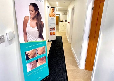 Entry hall at NovaLx Aesthetics Clinic, Brierley Hill, England, showcasing promotional banners.