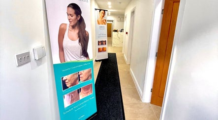 Entry hall at NovaLx Aesthetics Clinic, Brierley Hill, England, showcasing promotional banners.