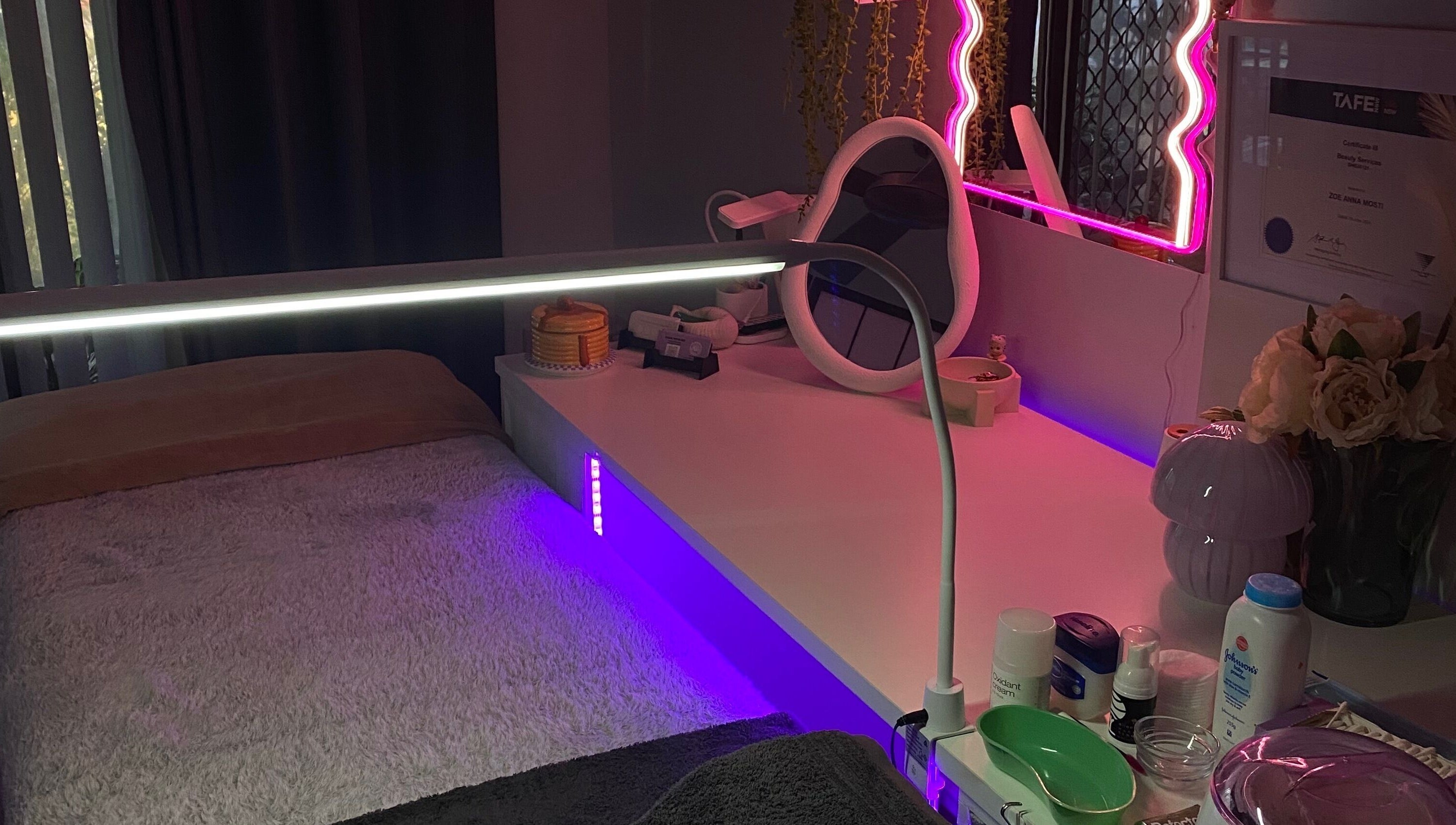 Cozy treatment room at Pretty In Paradise Beauty, Toormina, New South Wales, AU, with ambient lighting.